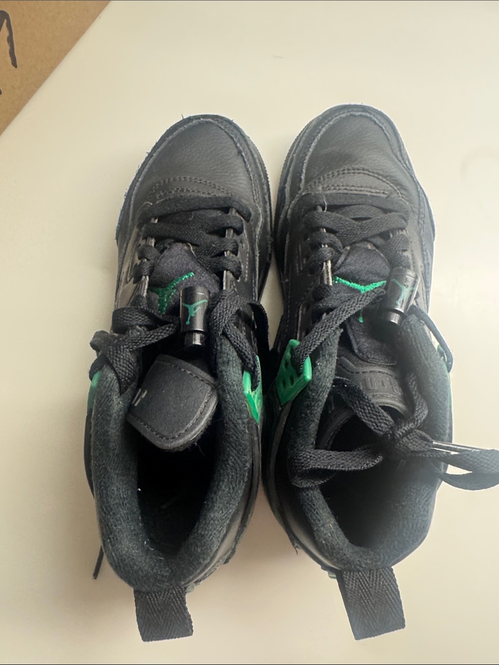 Nike Jordan’s Kids Black Sneakers with Green Accents